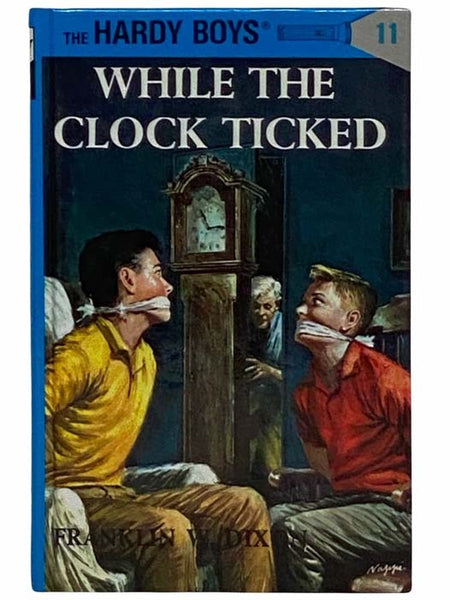 While the Clock Ticked (The Hardy Boys Mystery Stories, 11)